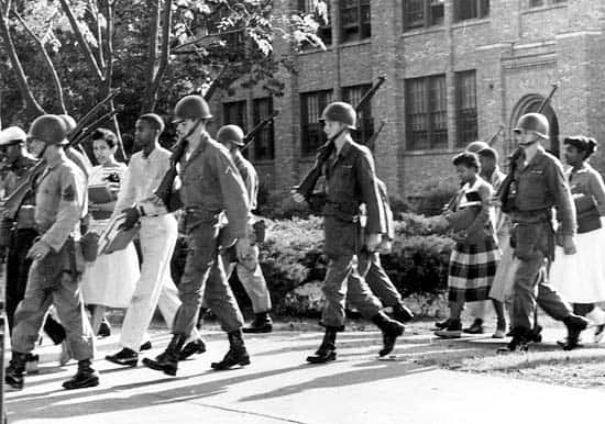 The Little Rock Nine being escorted by the National Guard to Little ...