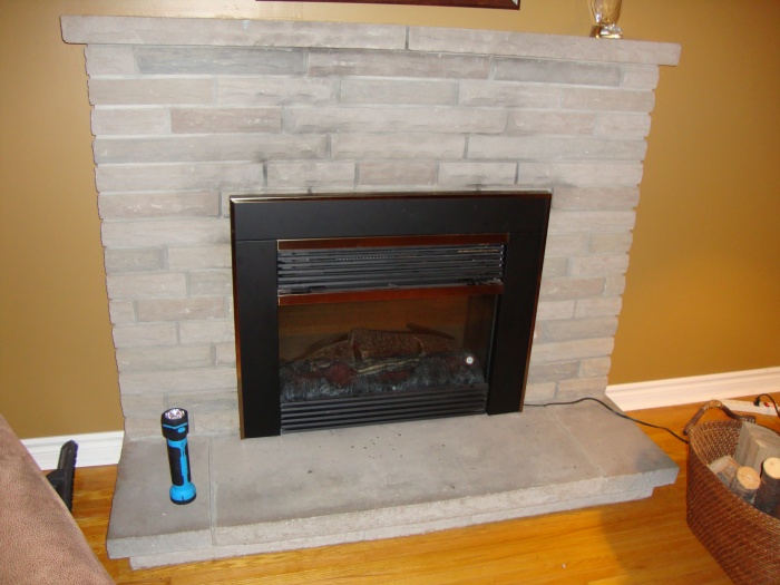 How do I insulate below a fireplace?