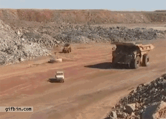 1303234680_huge-truck-goes-over-smaller-truck.gif