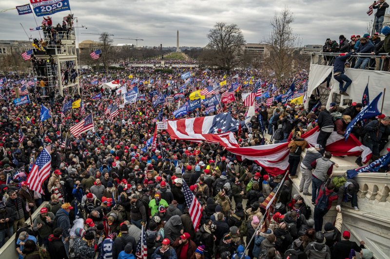 Capitol-riots-Man-who-appears-to-throw-extinguisher-at-officers-arrested.jpg