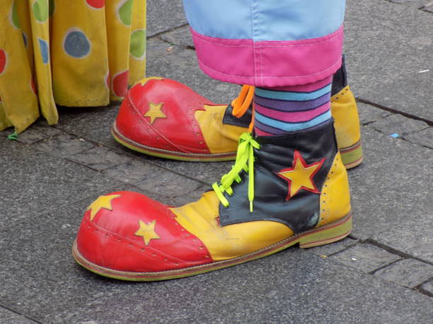 multicolored-clown-shoes-on-the-city-street-picture-id881931758